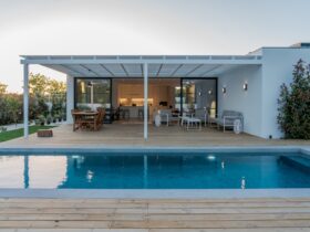 Modern house with garden swimming pool and wooden deck