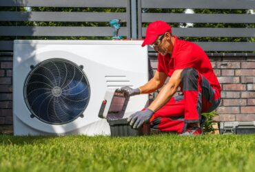 Professional Heat Pumps Technician Installing New Device