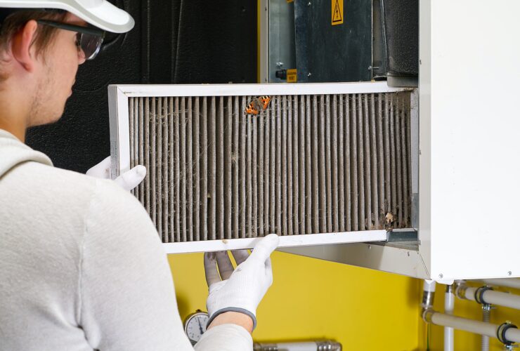 Replacing filter in the central ventilation system. hvac filter replacing home central air system