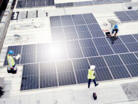 Solar energy, construction and employees building solar panels in collaboration for sustainability,