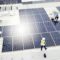 Solar energy, construction and employees building solar panels in collaboration for sustainability,