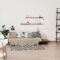 Stylish scandinavian living room with furniture, plants. Modern decor of bright room