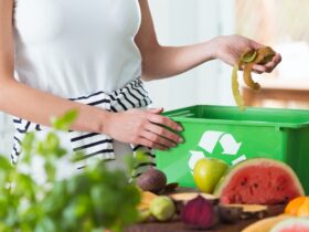 Woman composting organic kitchen waste