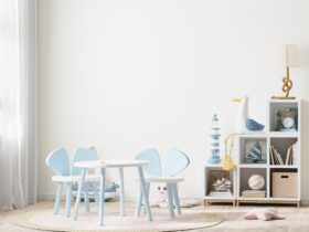 Bright children's room with kids table and shelves near window, kids furniture, kids room