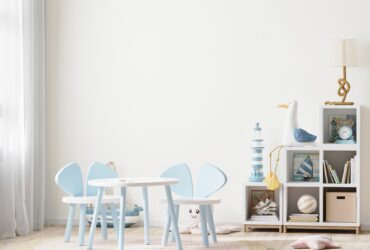 Bright children's room with kids table and shelves near window, kids furniture, kids room