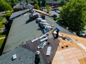Construction worker on a renovation roof the house installed new shingles