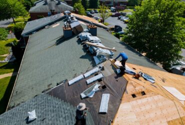 Construction worker on a renovation roof the house installed new shingles