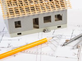 House under construction and accessories for drawing on electrical diagrams for project
