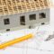 House under construction and accessories for drawing on electrical diagrams for project