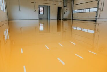 New epoxy floor in warehouse factory. Construction series