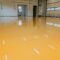 New epoxy floor in warehouse factory. Construction series