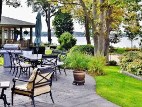 Patio outdoor living space on the lake with beautiful landscape design