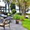 Patio outdoor living space on the lake with beautiful landscape design