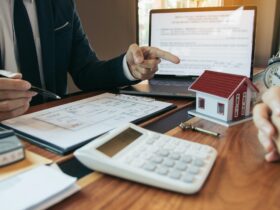Property sales staff submit land mortgage contract documents to home buyers for sign.