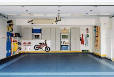 Surfboards and bicycles in empty garage
