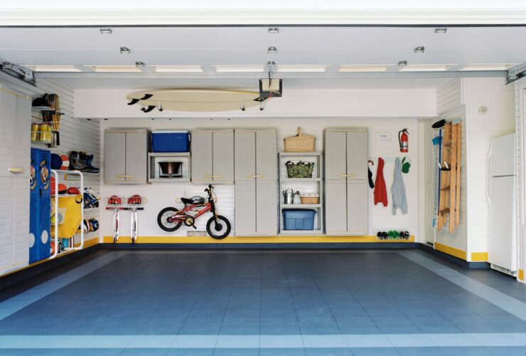 Surfboards and bicycles in empty garage