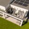 Top view of modern suburban house and green grass in the garden