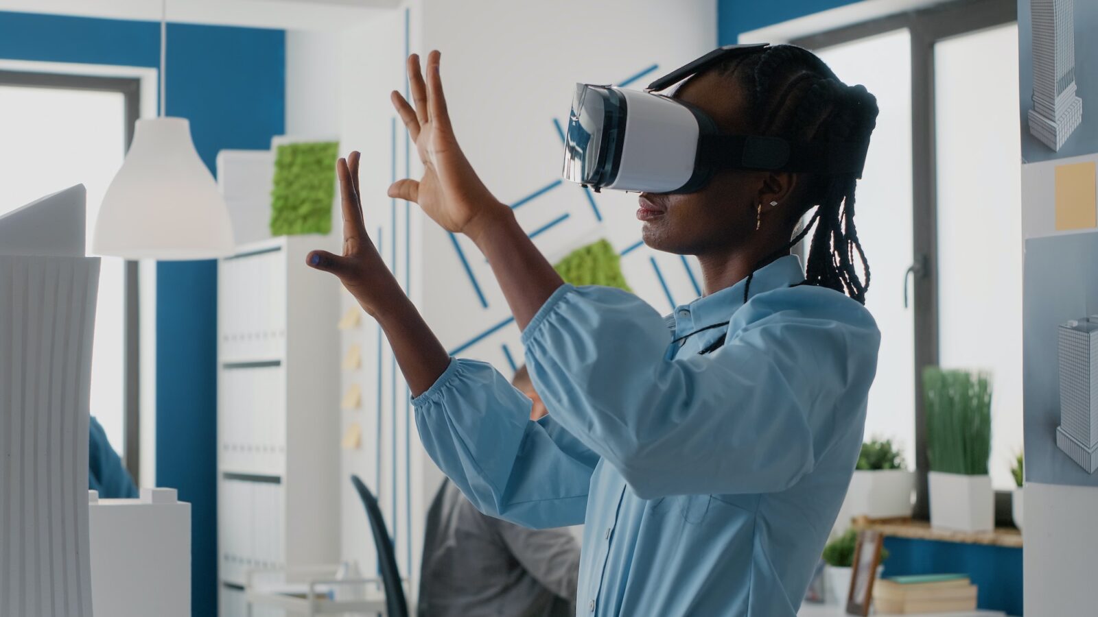 Woman architect working with vr glasses to design 3d building model for construction layout