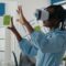 Woman architect working with vr glasses to design 3d building model for construction layout