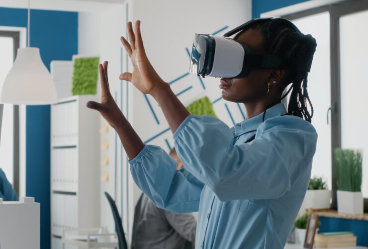 Woman architect working with vr glasses to design 3d building model for construction layout