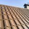Closeup of house roof top covered with metallic shingles