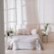 Light bedroom interior with morning sunlight