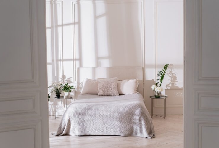 Light bedroom interior with morning sunlight
