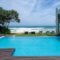 Modern house with a swimming pool, modern pool villa at the beach
