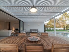 Modern house with garden swimming pool and wooden deck