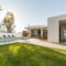 Modern house with garden swimming pool and wooden deck