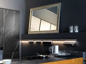 Part of the interior of the kitchen in black, modern minimalism.