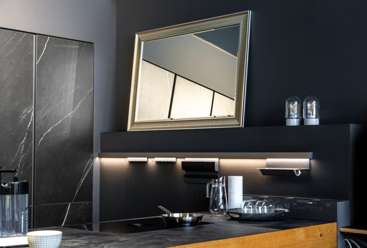 Part of the interior of the kitchen in black, modern minimalism.