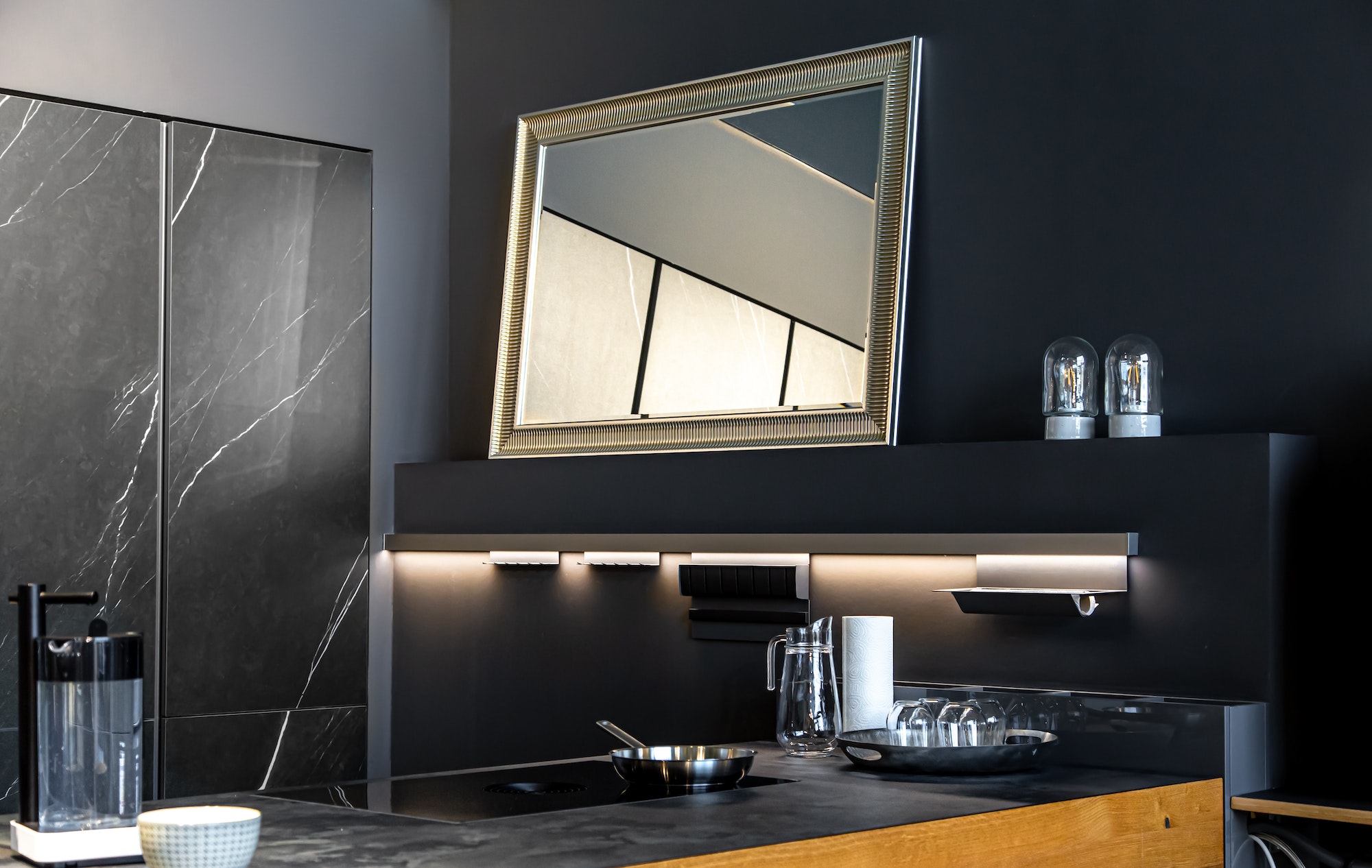 Part of the interior of the kitchen in black, modern minimalism.
