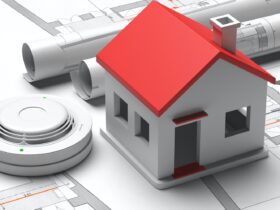 Smoke detector and small house on blueprint drawing background. Fire safety system. 3d illustration