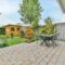 The backyard of a house with a summer dining room