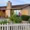 A couple doing home maintenance painting the exterior of their house together