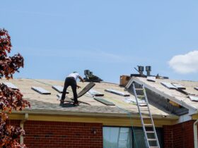 Home roof construction applying roof new shingles in apartment building