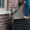 Putting cover on air conditioner unit