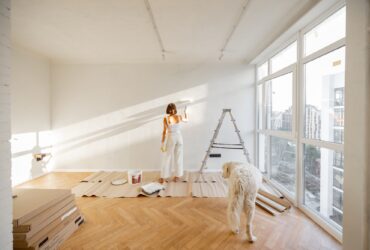 Woman with dog renovating house