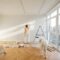 Woman with dog renovating house