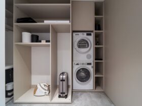 A Minimalist Apartment With A Cozy Gathering Space And A Color Splash 7