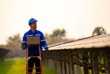 workers installing solar panels, for efficient energy in the city