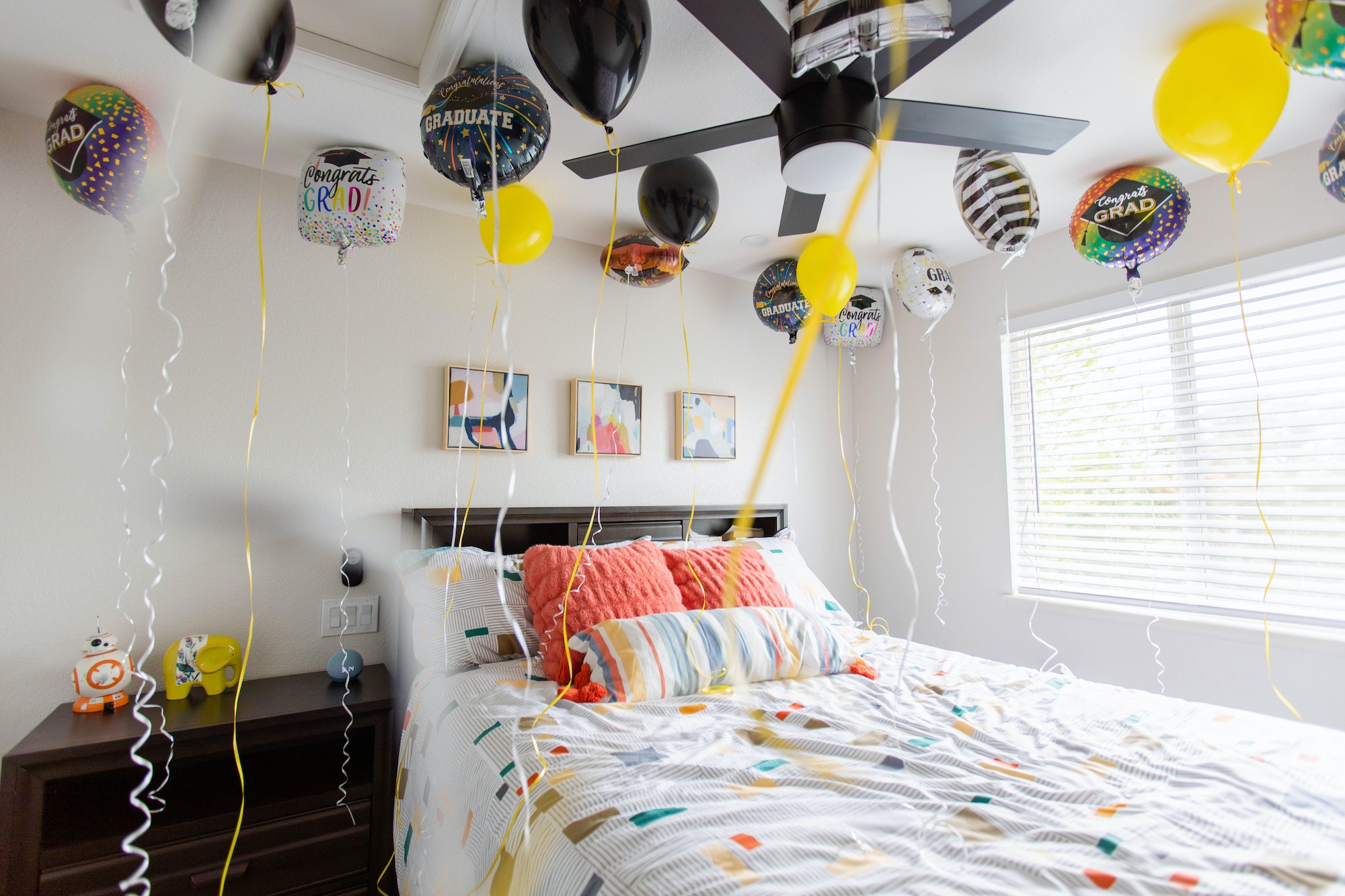 Graduation balloons in a bedroom