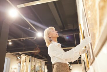 Art Gallery Manager Hanging Paintings
