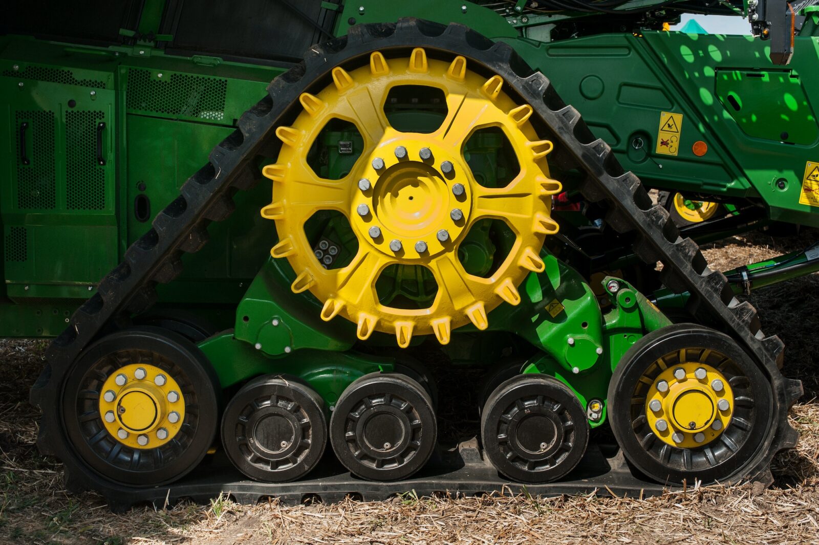 Bilogirya, Khmelnytsky region, UKRAINE - August 19, 2021: semi-tracked John Deere combine