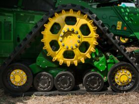Bilogirya, Khmelnytsky region, UKRAINE - August 19, 2021: semi-tracked John Deere combine