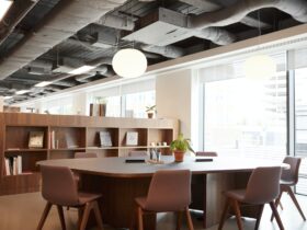 Chairs Around Table In Empty Modern Meeting Area Of Office
