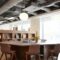 Chairs Around Table In Empty Modern Meeting Area Of Office