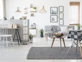 Checkered, stylish chair on a gray rug in a spacious, scandinavi