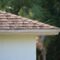 Closeup of house roof top covered with asphalt or bitumen shingles. Waterproofing of new building